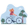 Young women riding bicycle among trees. Cycling girl practicing active eco life on bike in public city park. Royalty Free Stock Photo