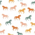 Seamless pattern with colorful walking horses silhouettes on white background. Royalty Free Stock Photo