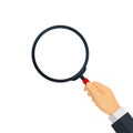 businessman\'s hand holding a magnifying glass.