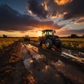 Agricultural workers with tractors. Ploughing a field with tractor at sunset Royalty Free Stock Photo