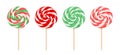 Christmas lollipops of red and green colors on wooden stick. Set of colorful swirl round candies. Royalty Free Stock Photo