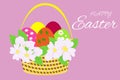 Easter basket with colored eggs and delicate apple tree flowers