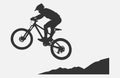 Epic Downhill Mountain Biker at the Jump - Met Black Silhouettes Vector Royalty Free Stock Photo