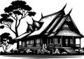 Silhouette of a traditional Thai house with steeply angled roofs and intricate design details. Royalty Free Stock Photo