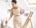 Art, inspiration and palette with painter woman in studio for creative, expression or leisure hobby. Canvas, passion and Royalty Free Stock Photo