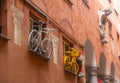 Art installation of two bicycles on the wall of a house in the city of Savona