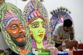 Art institute student preparing a big size colorful mask.