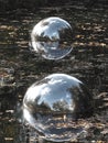 Big mirror balls in the water reflect the world