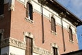 Art Nouveau building in the city of Busto Arsizio. Brick facade and floral decorations