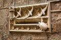 Art nouveau style stone mailbox decorated with swallows and turtle figurines on the wall of Casa de l'Ardiaca