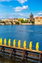 Art object march of yellow penguins. Weird art statues of Prague Royalty Free Stock Photo