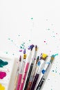 Art Paint brushes with colorful splatter on white canvas paper Royalty Free Stock Photo