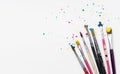 Art Paint brushes with colorful splatter on white canvas paper Royalty Free Stock Photo