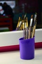 Art paint brushes in cup are located in the children& x27;s entertain Royalty Free Stock Photo