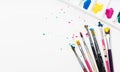 Art Paint brushes and palette with colorful paint splatter Royalty Free Stock Photo