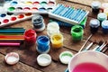 Art of Painting. Paint buckets on wood background. Different paint colors painting on wooden background. Painting set: brushes, pa Royalty Free Stock Photo