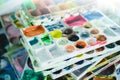 Art palette with blobs of paint and a brush in can Royalty Free Stock Photo