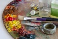 Art palette with brushes and paints