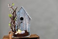 Art pastry chef, chocolate birdhouse with eggs and nest, spring dessert