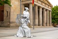 Art performance actors play statues on a city street