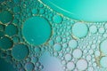 Art photo abstract background of bubbles of different sizes on a green background Royalty Free Stock Photo