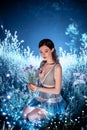Art photo fantasy fairy woman holds bouquet flower in hands. dark blue backdrop fabolous night nature forest. Firefly Royalty Free Stock Photo