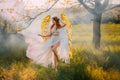 art photo fantasy woman angel with golden bird wings walking in forest fairy mystical girl greek goddess long white Royalty Free Stock Photo