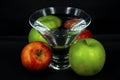 Art photo glass of water red and green apples on a black background Royalty Free Stock Photo