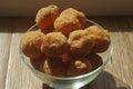 Art photo plates with Russian donuts close-up on a wooden background