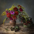 Still life with bouquet of garden flowers and forest fruits Royalty Free Stock Photo