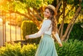 Art portrait happy woman dancing spinning in vintage straw hat on head, girl pretty smiling face red hair fly in wind Royalty Free Stock Photo