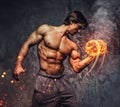 Portrait of a man with burning dumbbell. Royalty Free Stock Photo