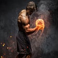 Portrait of a man with burning dumbbell. Royalty Free Stock Photo