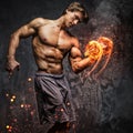 Portrait of a man with burning dumbbell. Royalty Free Stock Photo