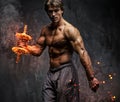 Portrait of a man with burning dumbbell. Royalty Free Stock Photo