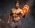 Portrait of a man with burning dumbbell. Royalty Free Stock Photo