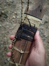 the art of rattan weaving on a traditional sword scabbard made of wood