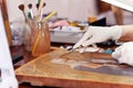 Art restorer working on the ancient icon Royalty Free Stock Photo