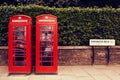 Art row of traditional phone boxes in London