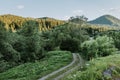 Mountain road. Landscape with rocks, sunny sky with clouds and beautiful asphalt road in the evening in summer. Vintage Royalty Free Stock Photo