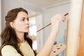 Student girl with easel painting at art school Royalty Free Stock Photo