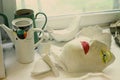 Art school still life with plaster face head, jars and broken plaster