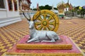 Art sculpture carving crouching deer figure and wheel of Dharmachakra dharma statue for thai people travelers travel visit of Wat