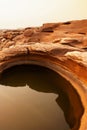 Art shape of sandstone pool in the Mekong River in summer