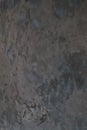 Art stylized decorative dark gray cement plaster wall as background texture