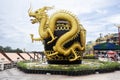 Art symbol of Rat Buri city glazed water jar and sculpture carving gold dragon riverside Mae Klong river for thai people travelers