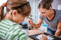 Art teacher helping a student with painting Royalty Free Stock Photo