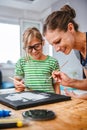 Art teacher helping a student with painting Royalty Free Stock Photo