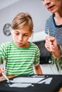 Art teacher helping a student with painting Royalty Free Stock Photo