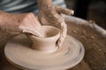 Women`s hands and potter`s wheel Royalty Free Stock Photo